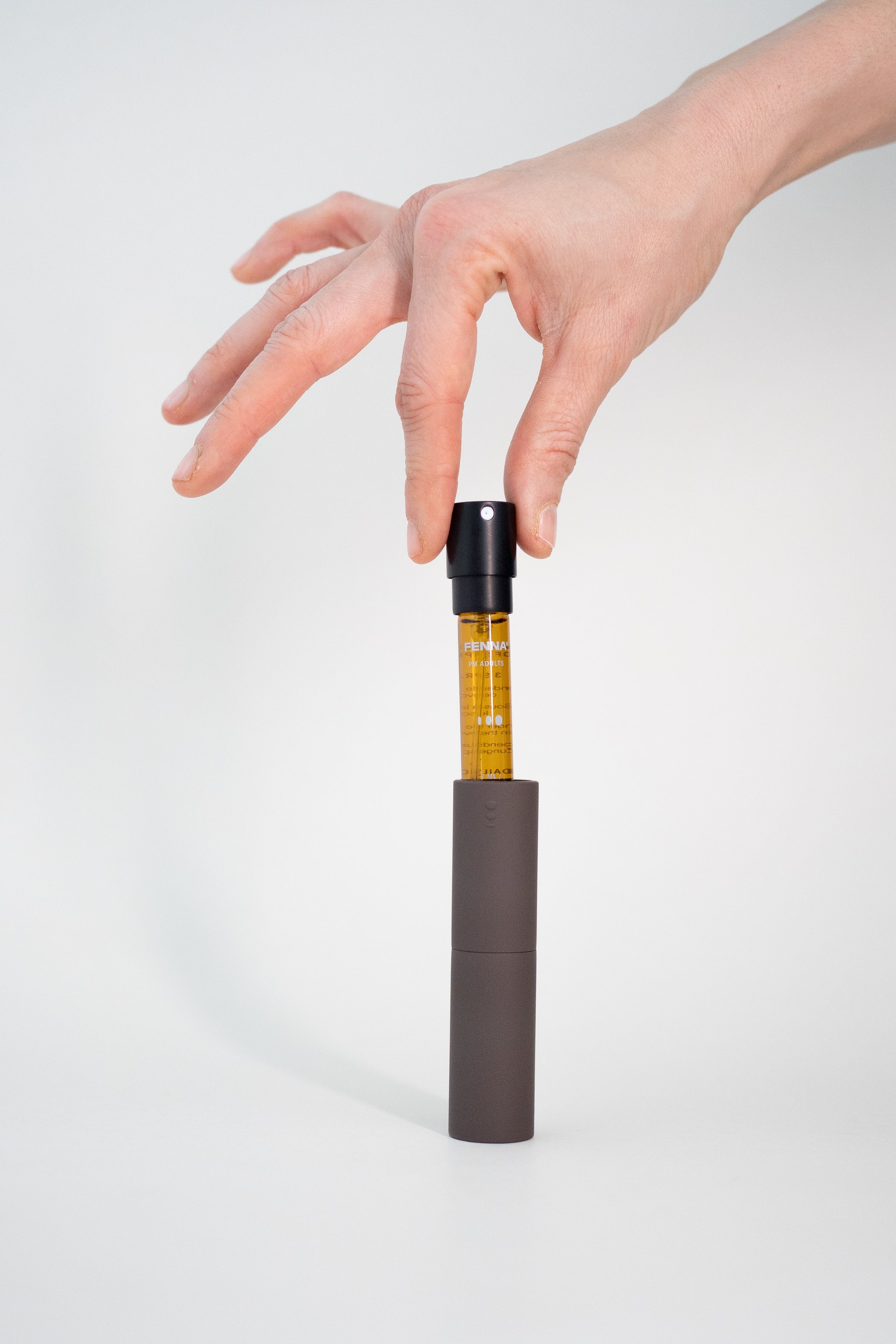 Hand-taking-Fenna-Vitamin-Refill-out-case
